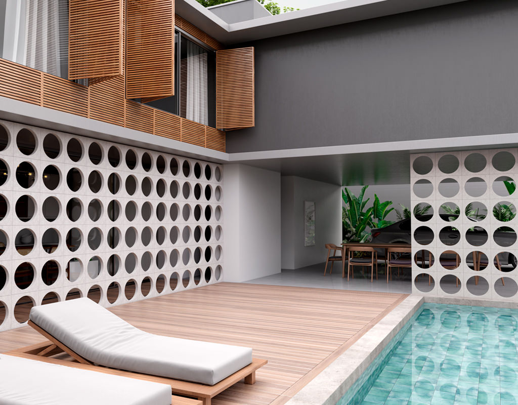 Área externa da casa, com uma piscina e espreguiçadeiras, o cobogó Void é usado para separar a piscina de outras áreas da casa.